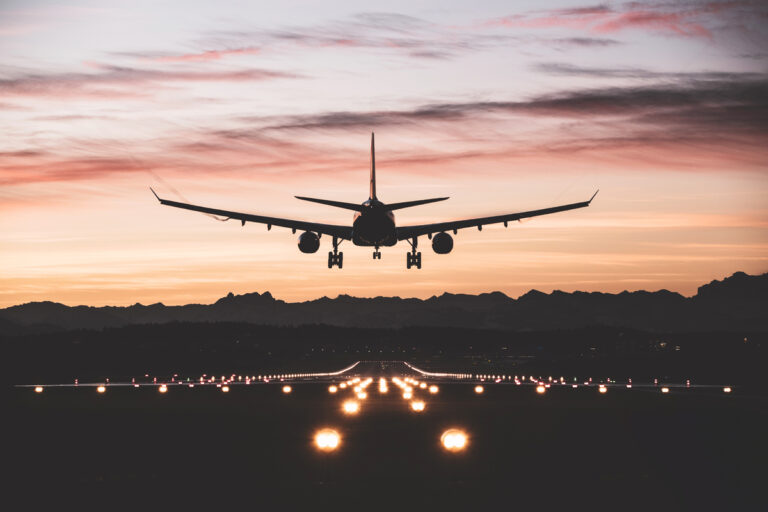 24 06 13 an airplane taking off or landing on a runway at sunset mf dload 1200x800 5b2df79