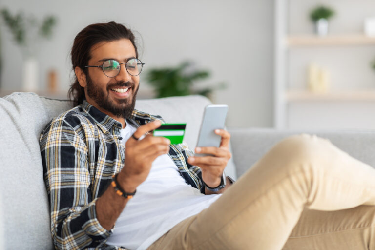 e commerce man smiling credit card