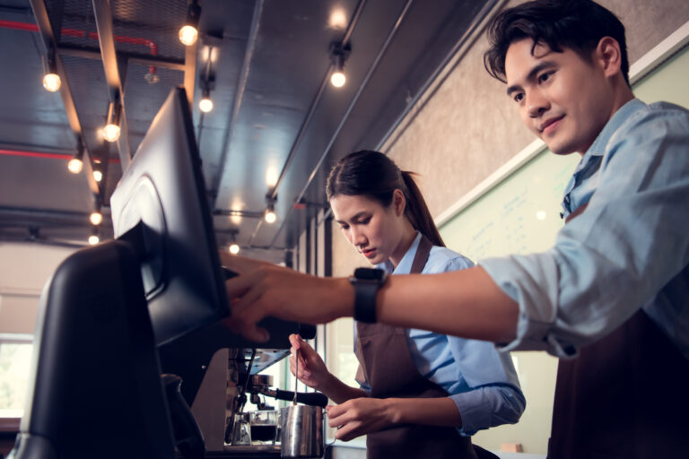 restaurant employees using touch screen monitor