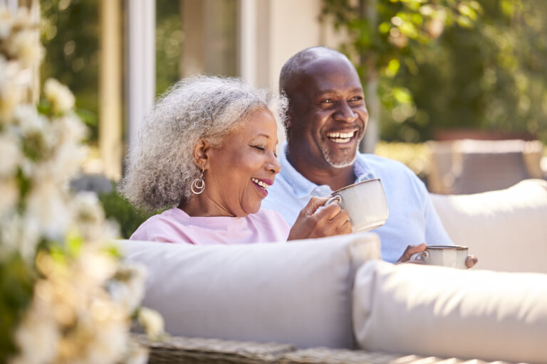 retired couple on patio happy