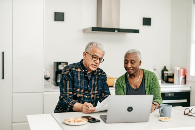 two people at a laptop gettyimages 1343586116