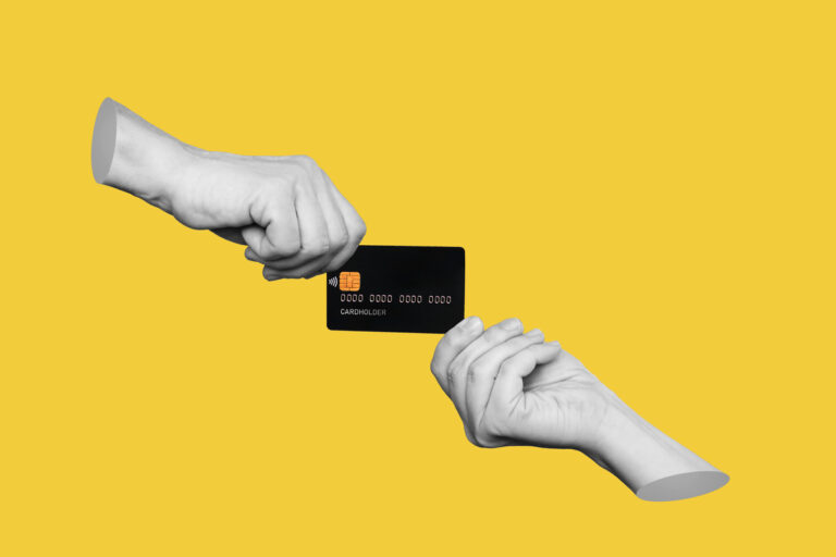 2 hands holding credit card