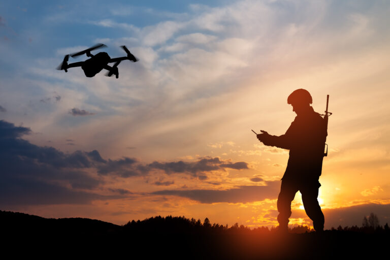 person flying a drone at dusk or twilight