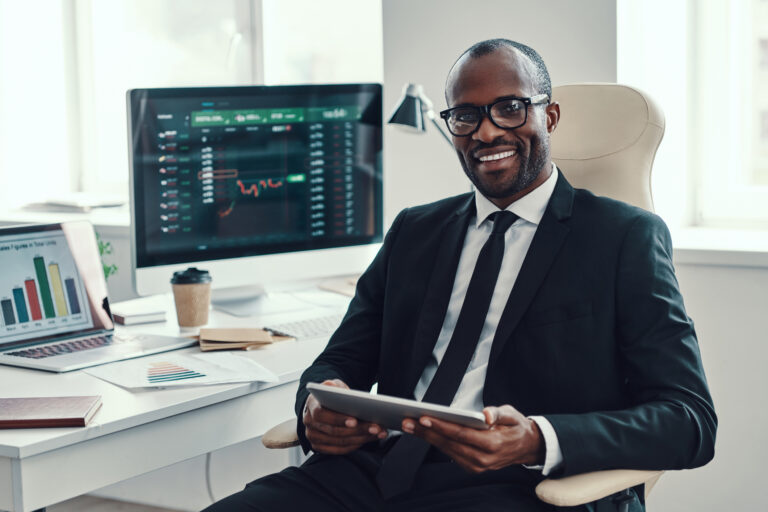 businessman with a stock chart in the background