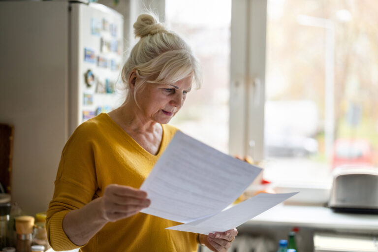 senior looking at documents