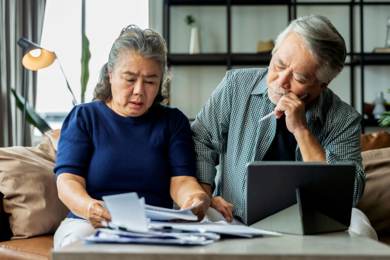 stressed couple looking at documents together